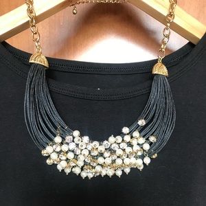 Bib style necklace with rhinestones and faux pearls
